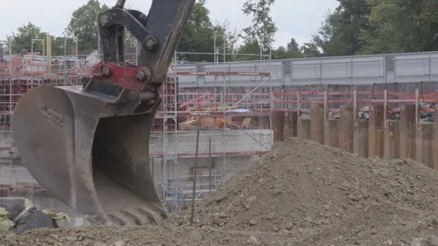 A backhoe tractor works on a construction site Stock Footage 81750971