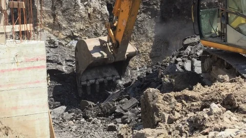 A backhoe tractor works on a construction site close up view Stock Footage 81751892