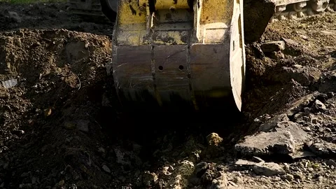 Backhoe working by digging soil at construction site 库存影片 254909873