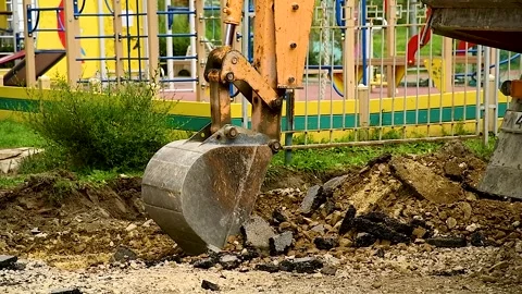 Backhoe working by digging soil at construction site Stock Footage 310053193