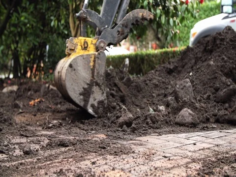 Backhoe working landscaping Stock Footage 74837019