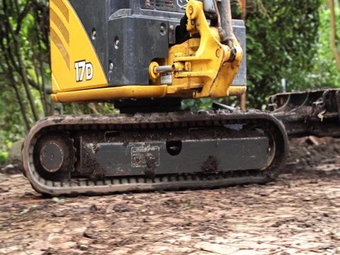 Backhoe working landscaping on tracks Stock Footage 74837293