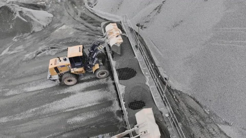 Backhoes load granite into sorting machine at mining pit Stock Footage 237027458
