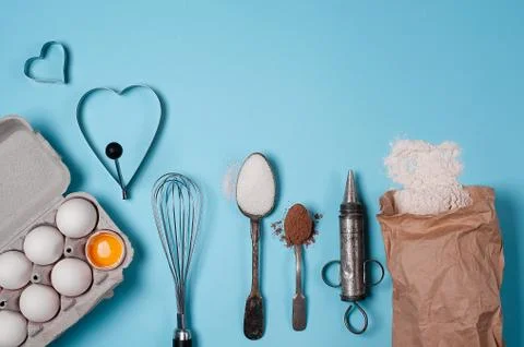 Backing background with ingredients for baking and kitchen tools. Stock Photos