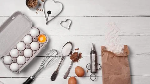 Backing background with ingredients for baking and kitchen tools. Stock Photos