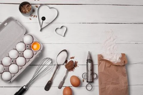 Backing background with ingredients for baking and kitchen tools. Stock Photos