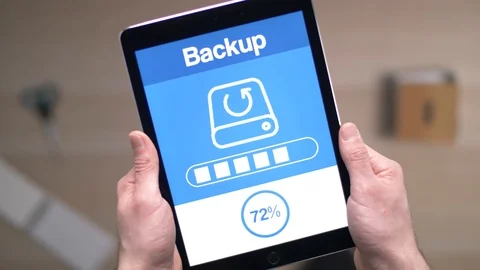 Backing Up Data on a Tablet Device Stock Footage 88341229