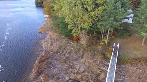 Backing Out Over a River to Reveal Small Lighthouse Video stock 97545249