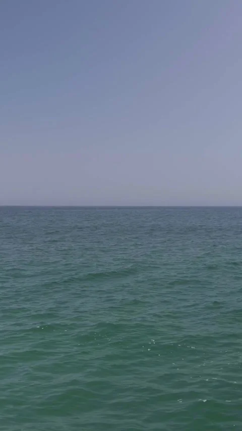 Backing View from Sea to Beach Stock Footage 285564478