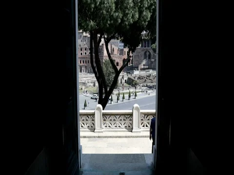 Backlight of a door with a view of ancient rome city center Stock Footage 74512771