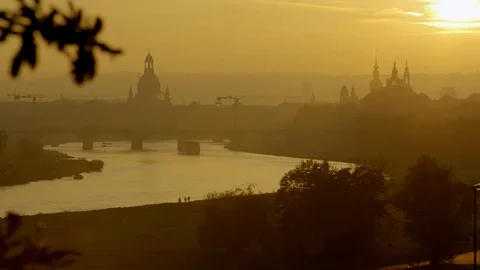 Backlight Setting to Dresden Skyline, a Ferry is Crossing the River Elbe Stock-Footage 72753861
