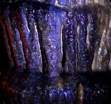 Backlight stalactites in the cave Stock Photos