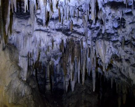 Backlight stalactites in the cave Stock Photos