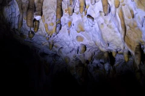 Backlight stalactites in the cave Stock Photos