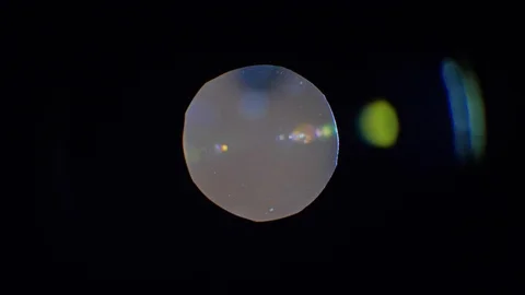 Backlight when light passes through the laser. Round spot on a black background Stock Footage 95525544