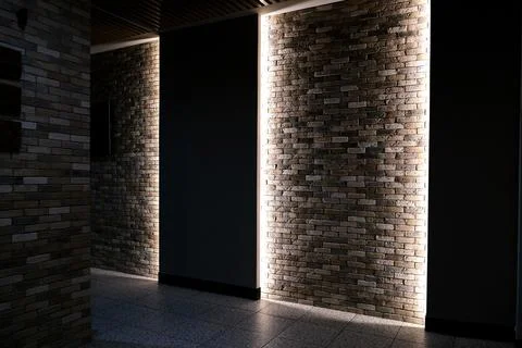 Backlit brick wall in an office building Stock Photos