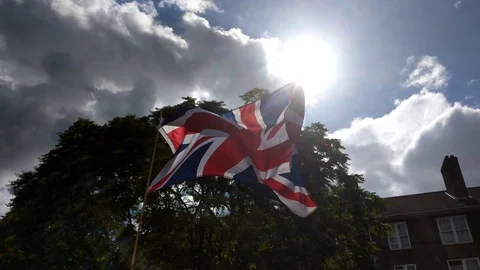 Backlit British Flag Waving - Slow Pan Down Stock Footage 100134762