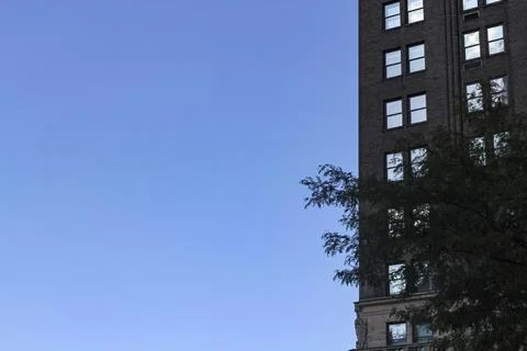 Backlit building with a cloudless blue sky Stock Photos