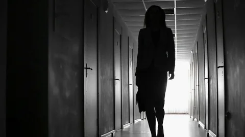 Backlit of Businesswoman Walking Stock Footage
