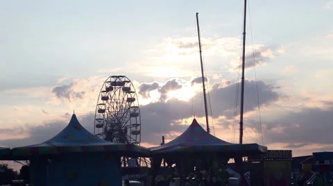 Backlit carnival rides Stock Footage 55874794