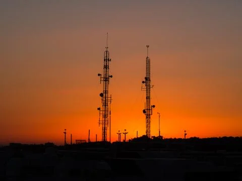 Backlit of cellular antenna tower Stock Photos