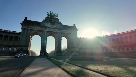 Backlit Cinquantenaire Arch in Brussels with sunbeam and morning haze Stock Footage 305668412