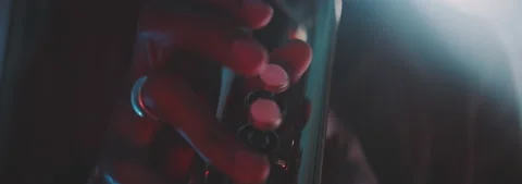 Backlit close up view of a trumpeter playing in his house Stock Footage 202310461