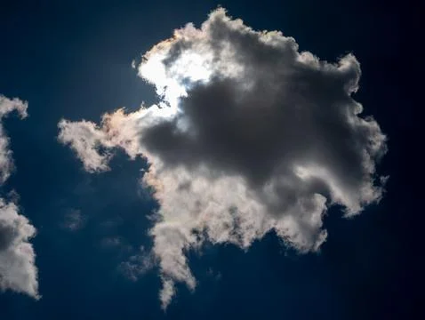 Backlit Cloud Against Deep Blue Sky Photos
