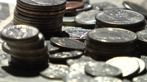 Backlit coins on a rotating turntable Video stock 35788787