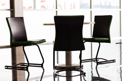 Backlit concept of chairs and table in office Stock Photos