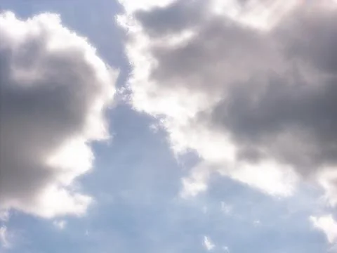 Backlit Cumulus Clouds With Bright Edges and Gray Centers Stock Photos