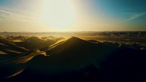 Backlit desert, sunset, drone shoot over the desert Stock Footage 329598948