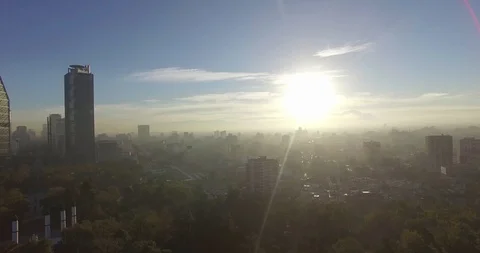 Backlit drone reveal of Chapultepec Castle starts with Mexico City skyline. Video stock 126047922
