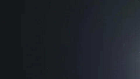 Backlit dust particles with bubble like bokeh floating in slow motion Stock Footage 70453473