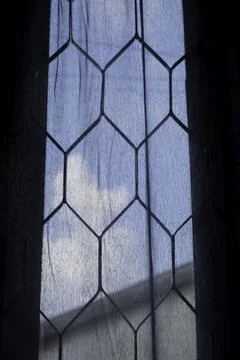 Backlit geometric pattern on a leaded glass window panel set Stock Photos