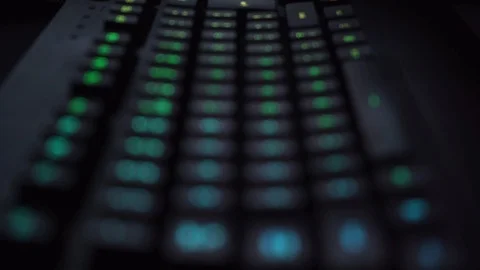 Backlit Illuminated Keyboard Keys in a Close-up Zoom Stock Footage 101256240