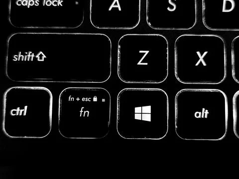 Backlit keyboard captured in low light setting Stock Photos