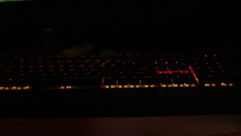 Backlit keyboard at home. Colored light. Mechanical keyboard. Working office. Video stock 129810475