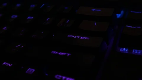 Backlit keyboard at home. Colored light. Mechanical keyboard. Working office. Video stock 129810493