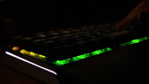 Backlit keyboard at home. Colored light. Mechanical keyboard. Working office. Video stock 129810509