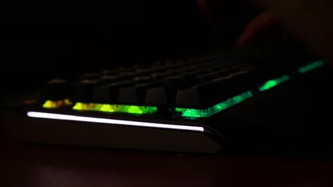 Backlit keyboard at home. Colored light. Mechanical keyboard. Working office. Video stock 129810510