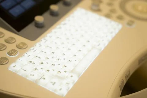 Backlit keyboard keys on a sonogram machine. Stock Photos
