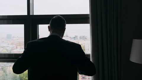 Backlit man with a jacket unusual shot Stock Footage 274471597