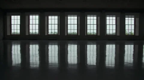 Backlit man walking in from of windows in slow motion Stock Footage 63969513