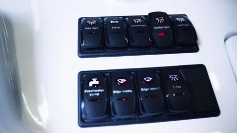 Backlit Marine Switch Panel Rocker Buttons on Boat, Cockpit Console, Close Up Stock Footage 340329906