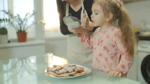 Backlit Medium Shot Mother Sifting Powdered Sugar Over Cookies Stock Footage 334037506