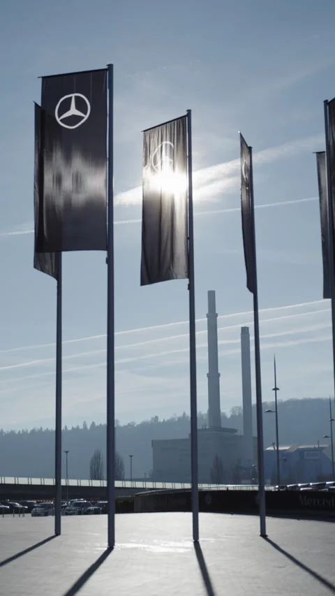 Backlit Mercedes-Benz flags outside the museum in Stuttgart Stock Footage 340333090