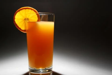 Backlit orange juice Stock Photos
