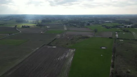 Backlit Overflying drone aerial field generic green trees grass rural Stock Footage 233295951