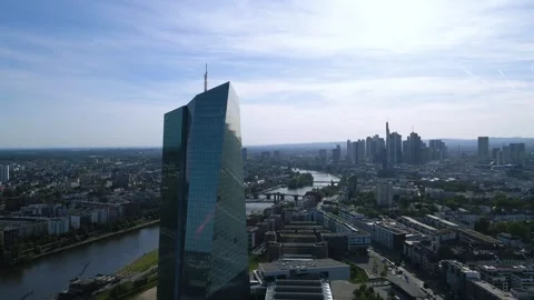 Backlit pass behind ECB facade with mirrored skyline Stock Footage 331874626